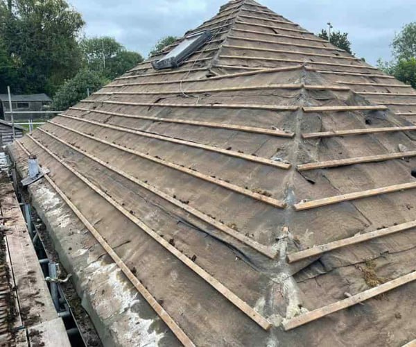 This is a photo of a hip roof that has been stripped back to the battens, and is awaiting a new roof covering to be installed. Works carried out by LKN Roofing Shortstown